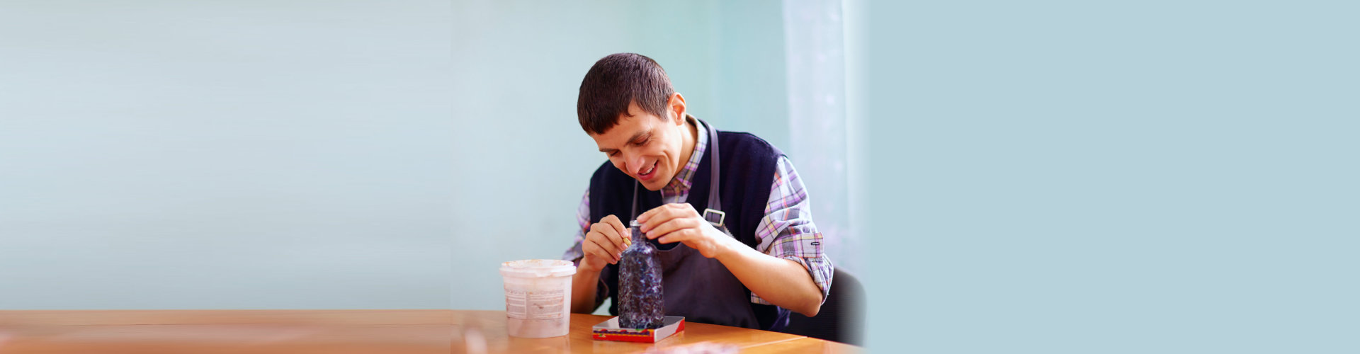 young man doing an artwork