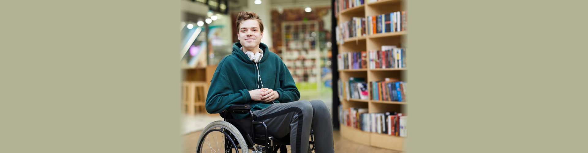 guy on a wheelchair at library.